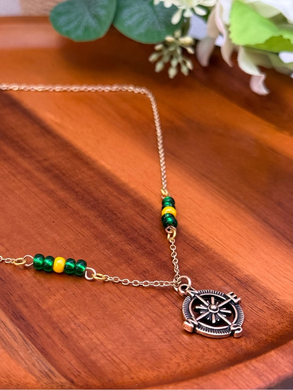 Gold-Tone Compass Pendant Necklace with Green and Yellow Beads